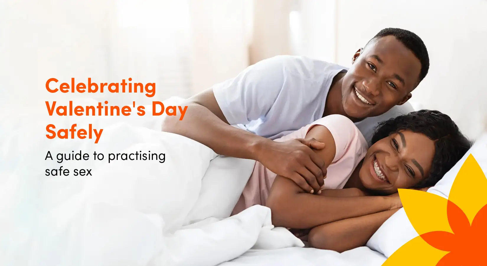An image promoting promoting safe sex practices for Valentine's Day with a smiling couple lying in bed.